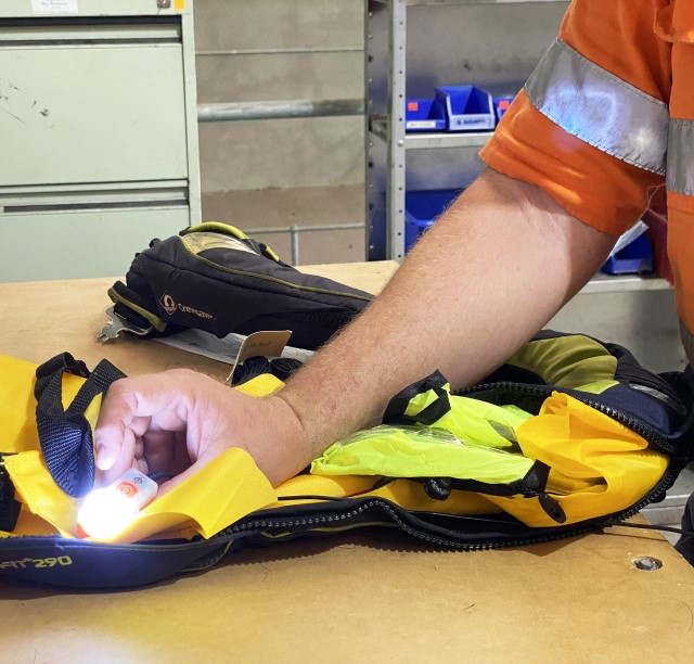 Technician servicing a life jacket